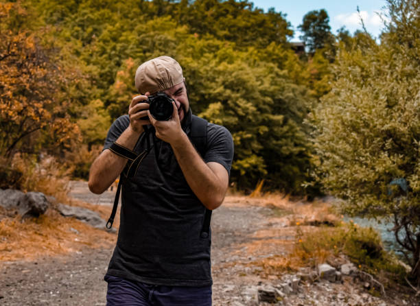 Stock photography of nature photographer shooting Mother Nature